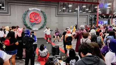 Attendees dance in the lobby of the Donald E. Stephens Convention Center