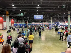 Attendees line up at registration to get their badges.